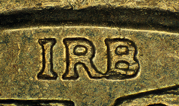 Designer initials on pound coin