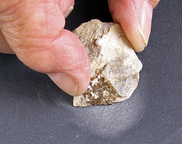 Polishing rock with sandpaper