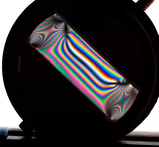 Colour fringes in a stressed polycarbonate sheet