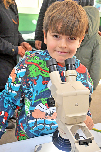 Boy with microscope