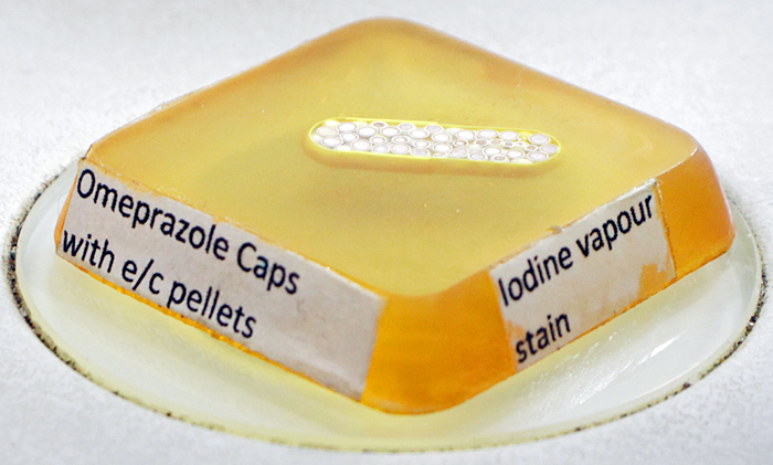 Sectioned omeprazole capsule